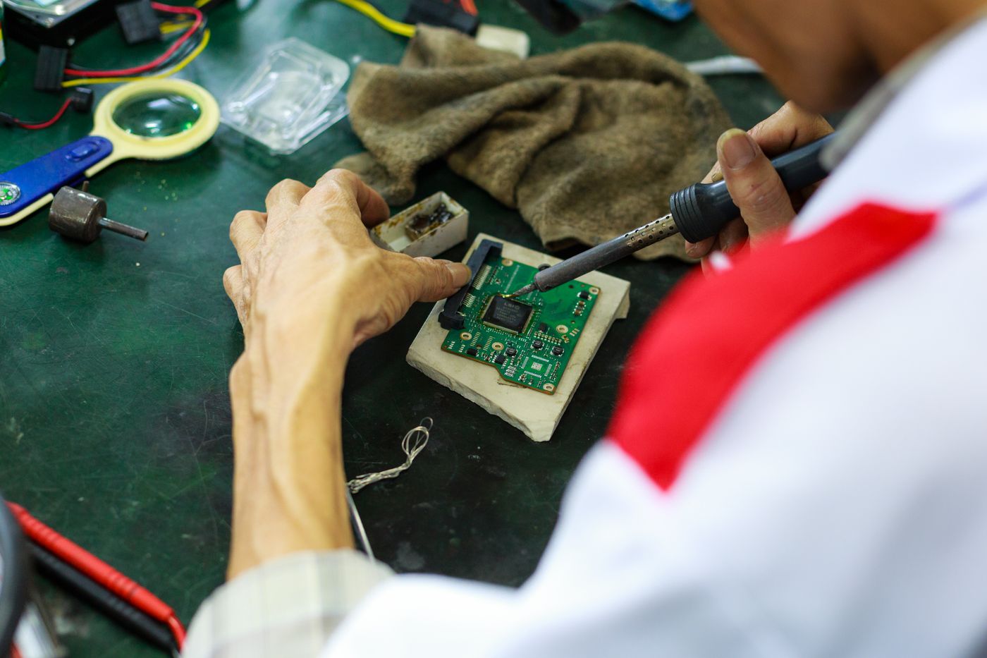 Repairing a circuit board with a soldering iron